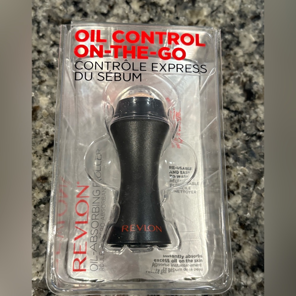 New in package- Revlon oil-absorbing volcanic roller